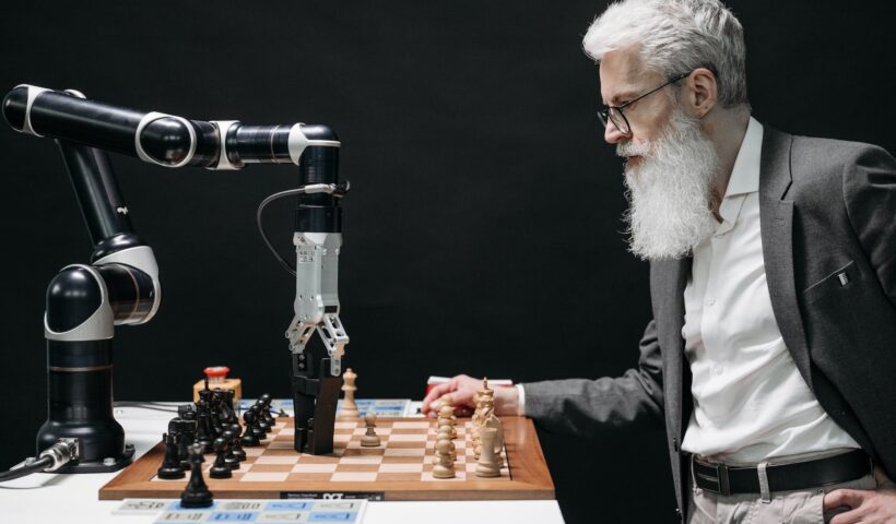 a bearded man playing chess